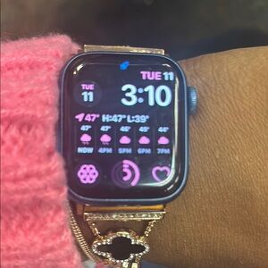 Gold and Black Smartwatch with Rectangular Display and Weather Updates